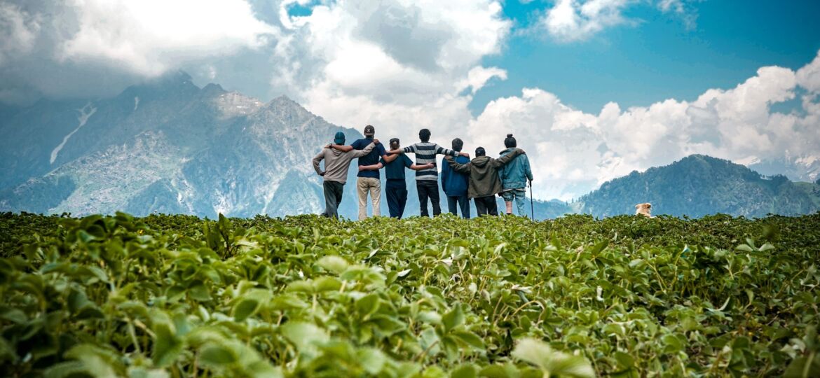 Young friends on top of a mountain enjoying the mesmerizing view